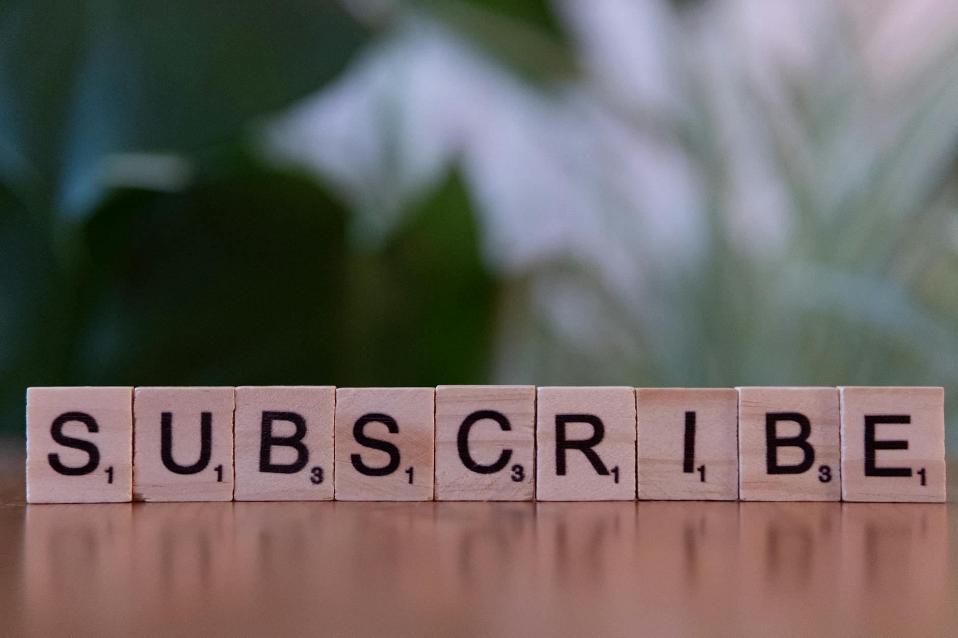creative subscribe text with wooden blocks