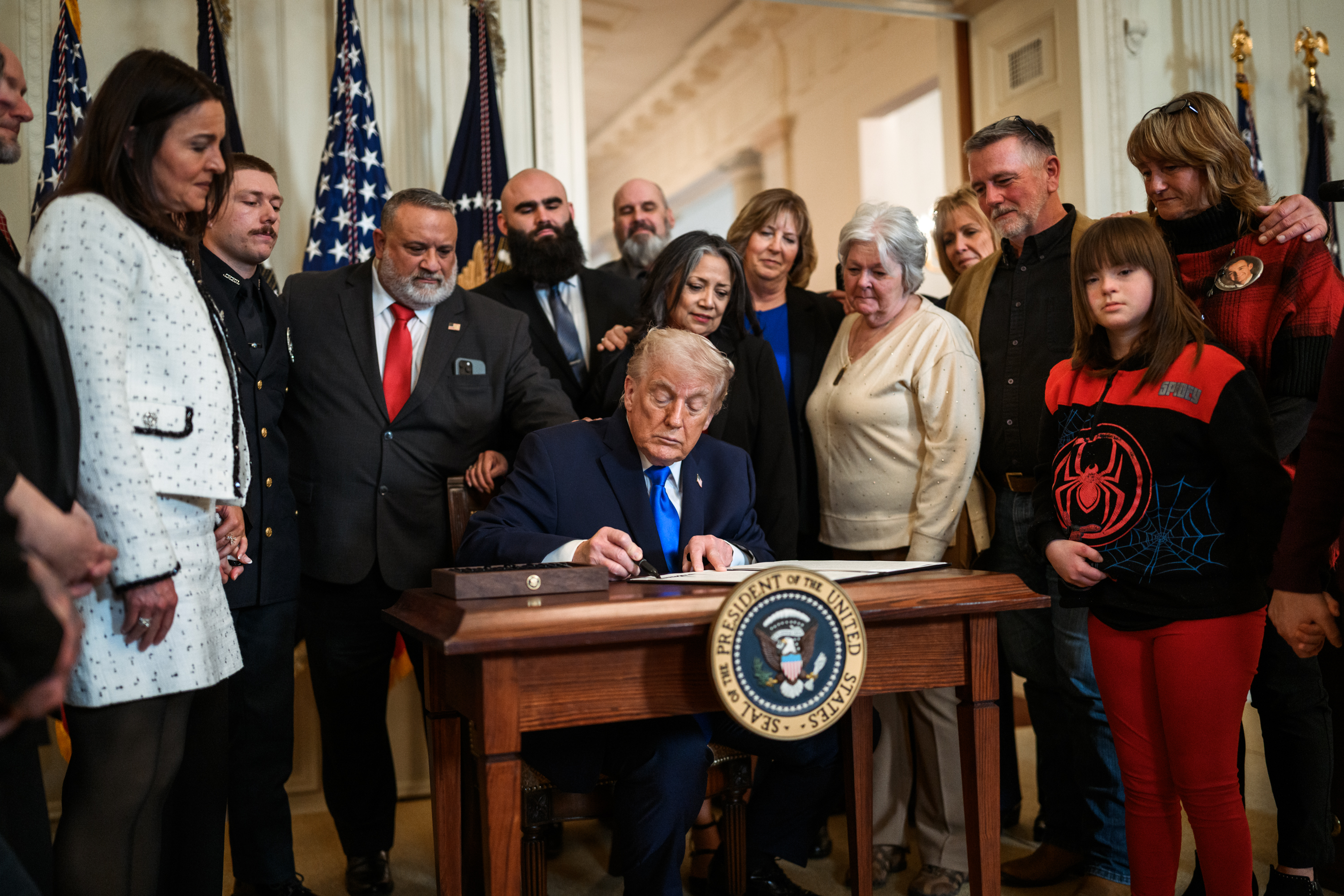 President Donald Trump signs a proclamation at an Angel Families Remembrance Ceremony, Monday, February 23, 2026, in the East Room of the White House. (Official White House Photo by Daniel Torok)